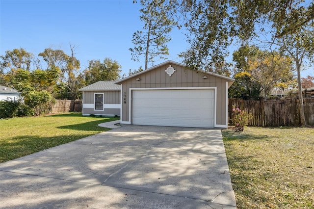 view of front of house with a garage and a front yard