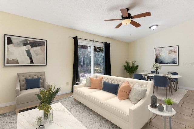 living room featuring light tile patterned floors, a textured ceiling, and ceiling fan