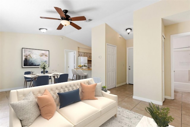 tiled living room featuring vaulted ceiling and ceiling fan