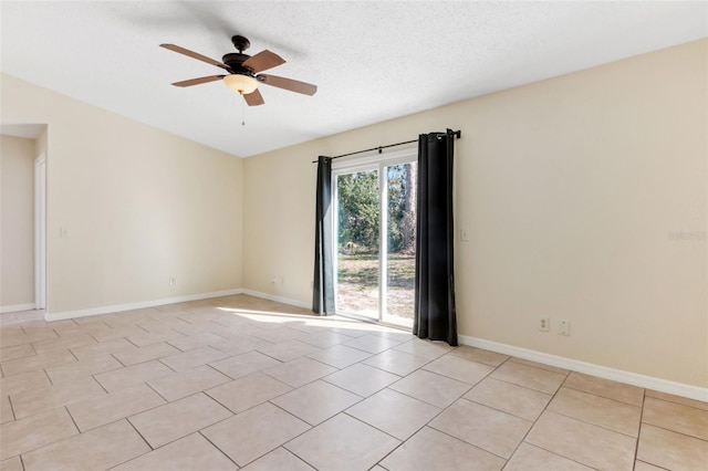 unfurnished room featuring light tile patterned floors, a textured ceiling, and ceiling fan