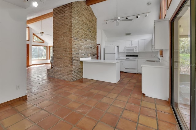 kitchen featuring light countertops, a peninsula, white appliances, high vaulted ceiling, and a ceiling fan