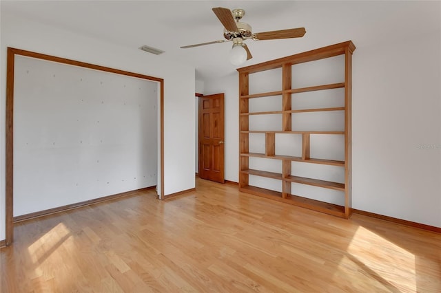 unfurnished bedroom with visible vents, baseboards, ceiling fan, a closet, and light wood-type flooring