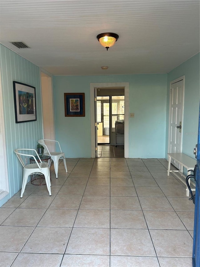 corridor featuring tile patterned flooring