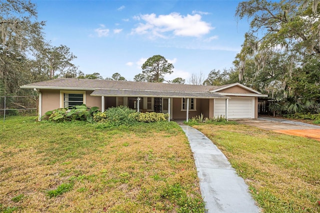 single story home with a garage and a front lawn