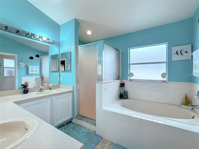 bathroom with vanity, lofted ceiling, tile patterned floors, and a shower with shower door