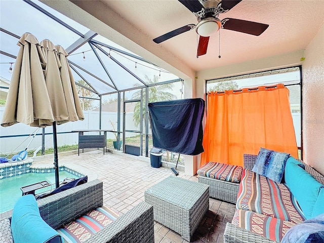 view of patio / terrace with a lanai, an outdoor hangout area, and ceiling fan