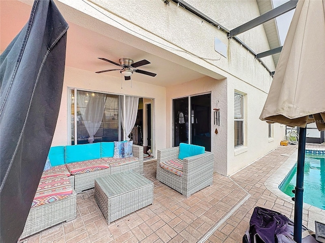 view of patio with an outdoor hangout area and ceiling fan