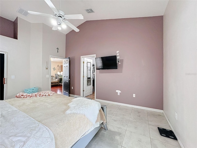 bedroom featuring high vaulted ceiling, light tile patterned floors, and ceiling fan