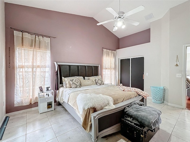 tiled bedroom featuring vaulted ceiling and ceiling fan