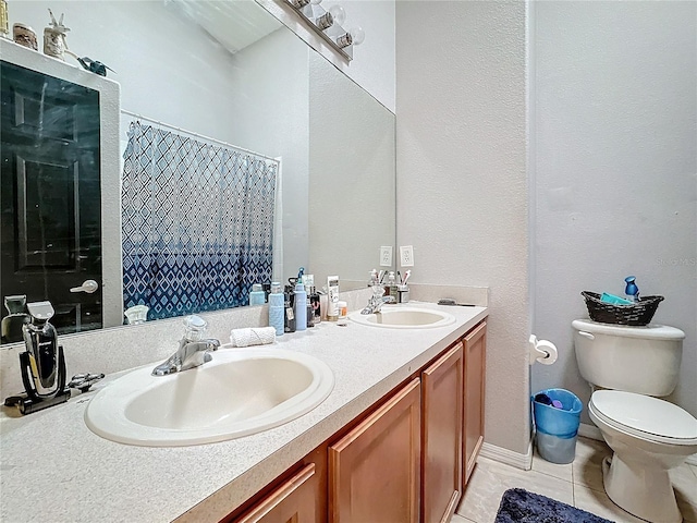 bathroom with walk in shower, tile patterned floors, toilet, and vanity