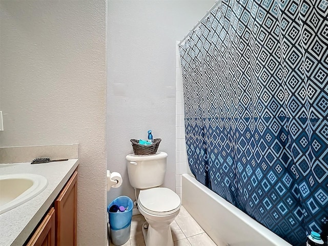 bathroom with vanity, tile patterned flooring, and toilet