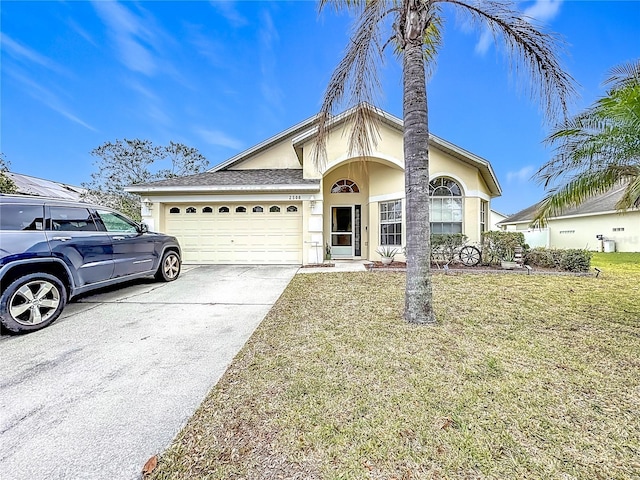 single story home with a garage and a front yard