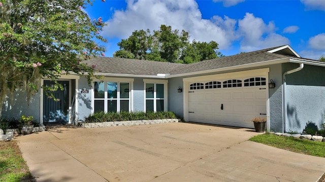 ranch-style house featuring a garage