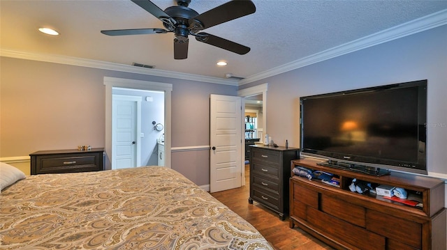 bedroom with connected bathroom, crown molding, dark wood-type flooring, and ceiling fan