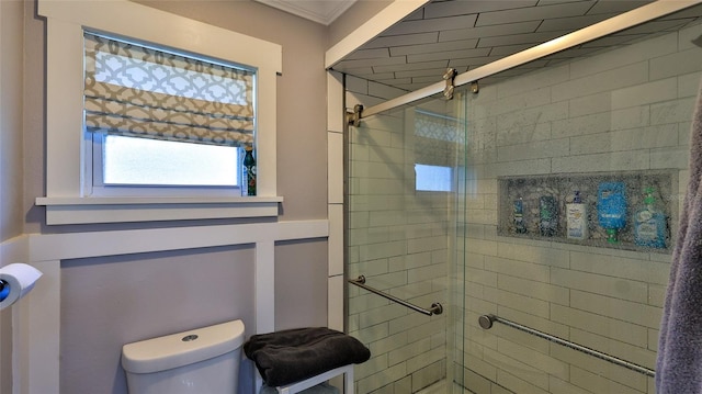 bathroom with an enclosed shower and toilet