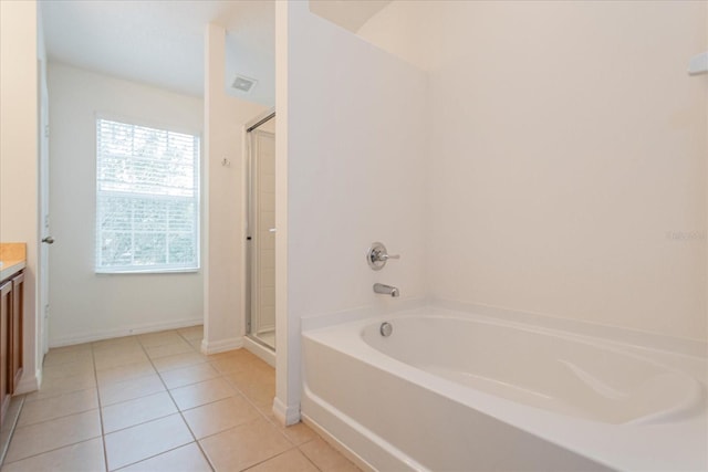 bathroom with vanity, tile patterned flooring, and independent shower and bath