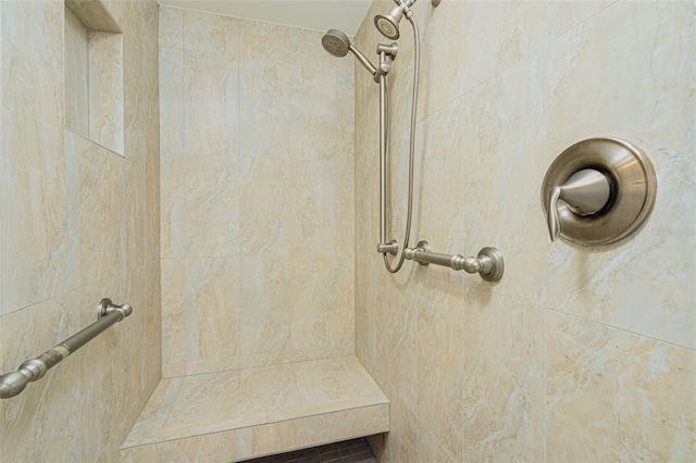 bathroom featuring a tile shower