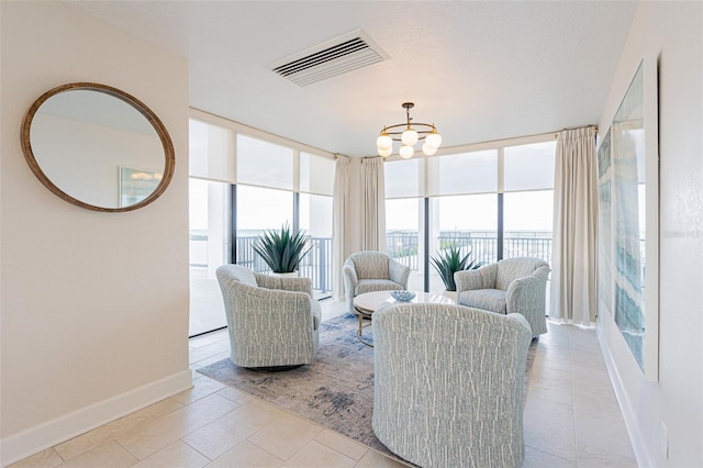 tiled living room with expansive windows and a notable chandelier