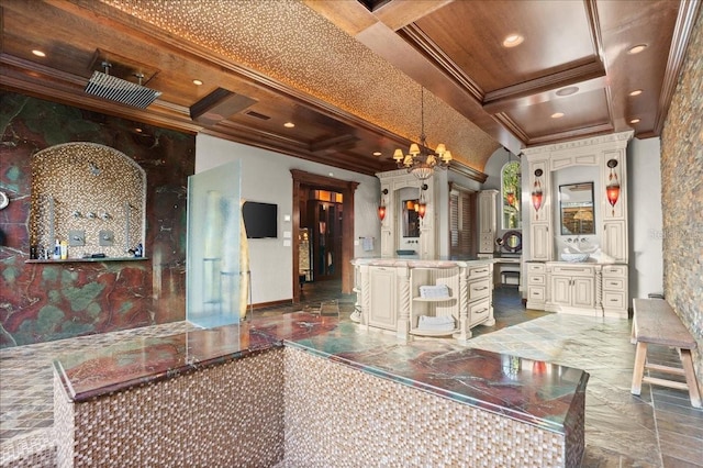 interior space with ornamental molding, beam ceiling, coffered ceiling, and a notable chandelier