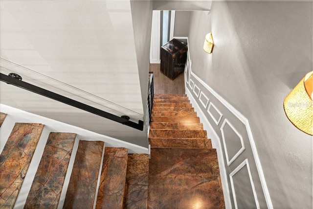 stairway with hardwood / wood-style floors