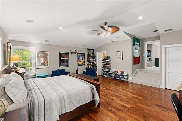 bedroom with ceiling fan, wood-type flooring, a closet, and lofted ceiling