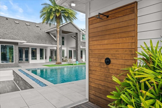 view of swimming pool featuring a patio area