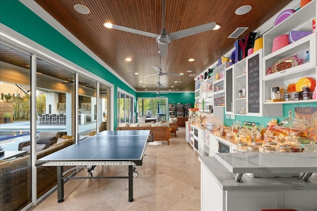 game room featuring ceiling fan, crown molding, and wood ceiling