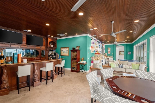 dining area with ceiling fan, ornamental molding, and wooden ceiling