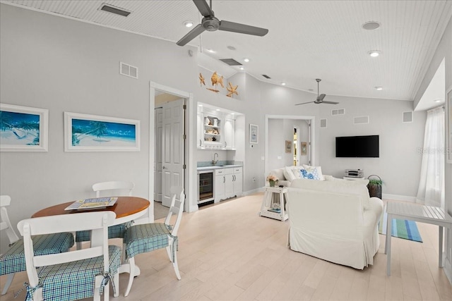 living room featuring high vaulted ceiling, wooden ceiling, beverage cooler, and light wood-type flooring