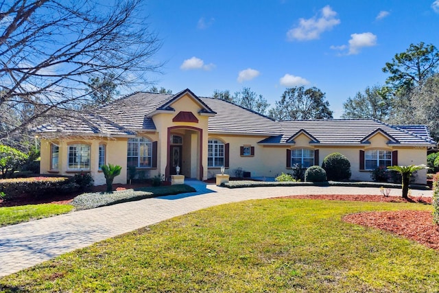 ranch-style house with a front yard