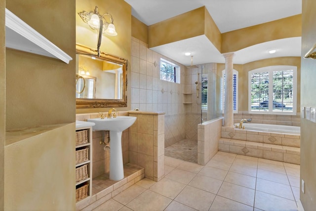 bathroom featuring decorative columns, sink, tile patterned floors, and independent shower and bath