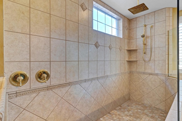 bathroom featuring tiled shower