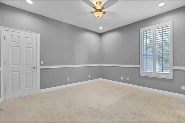 unfurnished room featuring ceiling fan and carpet floors