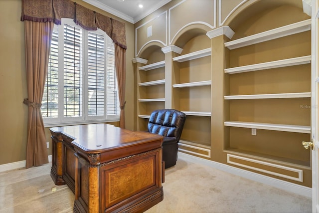 carpeted home office with a wealth of natural light, built in features, and ornamental molding