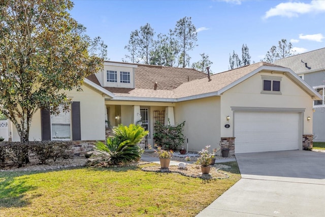 view of front of property featuring a garage and a front lawn