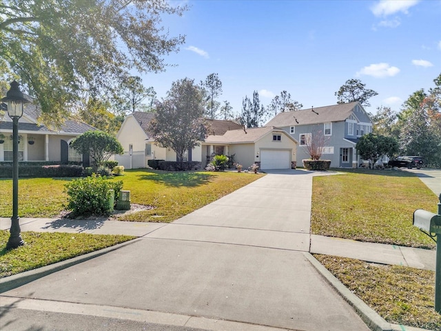 front of property featuring a garage and a front yard