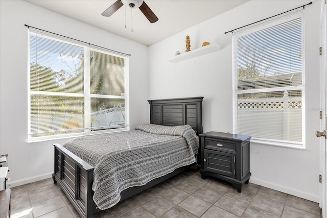 tiled bedroom with ceiling fan