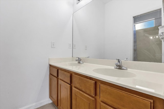 bathroom featuring walk in shower and vanity