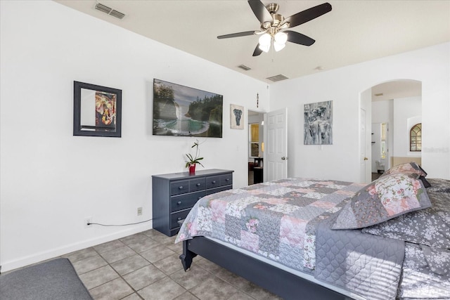 bedroom with ceiling fan and tile patterned floors