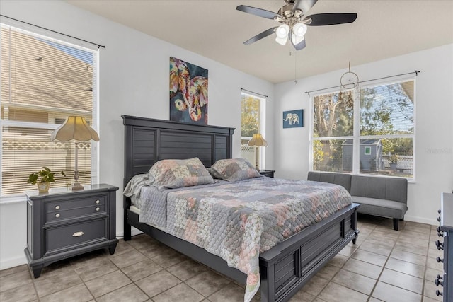 bedroom featuring ceiling fan and light tile patterned flooring