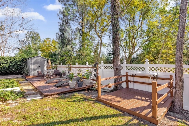 wooden terrace featuring a storage unit