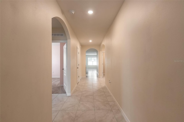 hall with light tile patterned flooring