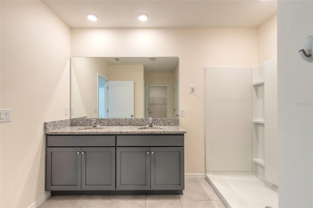 bathroom featuring tile patterned flooring and vanity