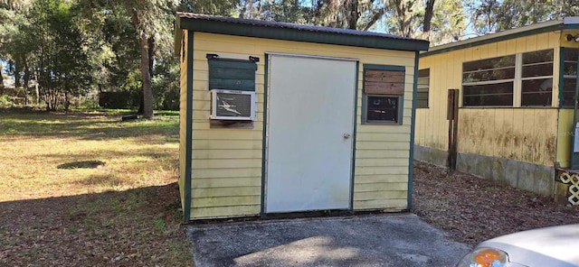 view of outbuilding with a yard