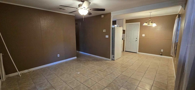 empty room featuring ceiling fan with notable chandelier and crown molding