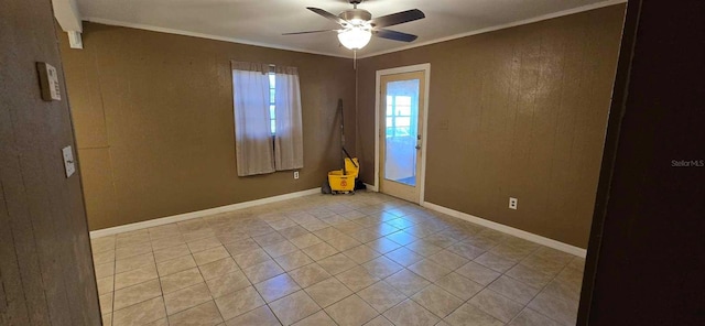 unfurnished room with light tile patterned flooring, ceiling fan, and ornamental molding