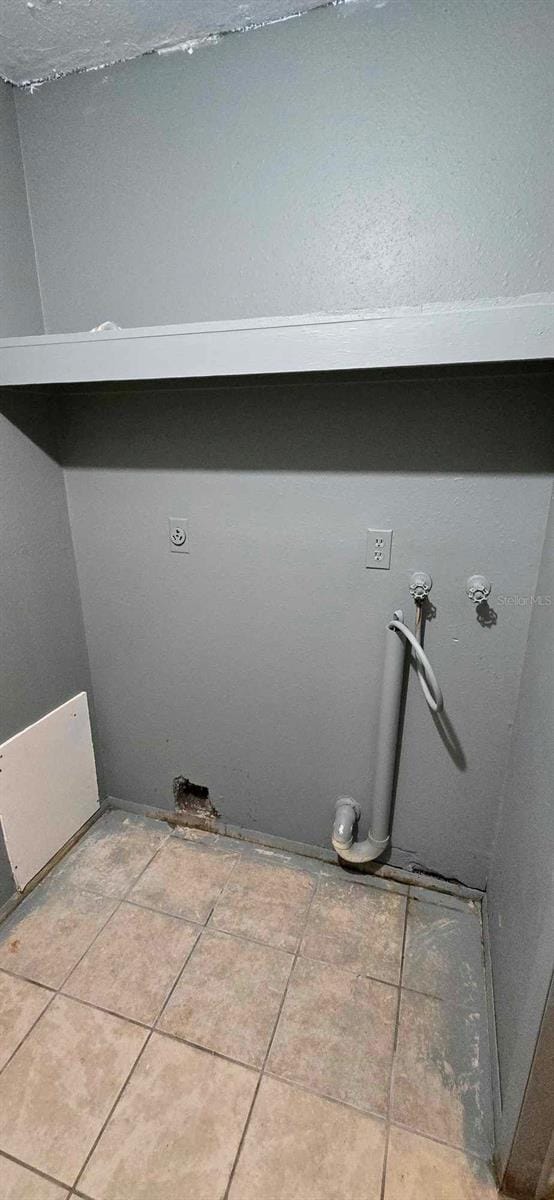 laundry room with tile patterned floors