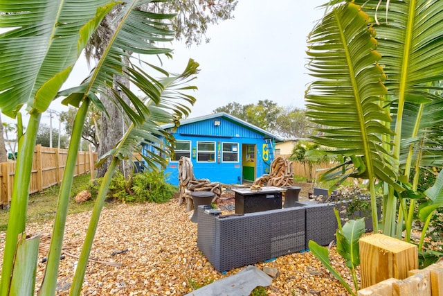 exterior space featuring an outdoor fire pit and an outdoor structure