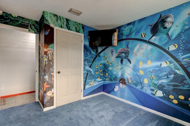 unfurnished bedroom featuring carpet and a textured ceiling