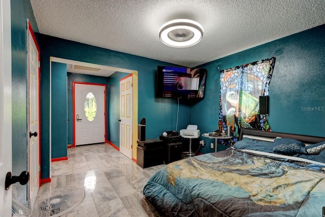 bedroom featuring a textured ceiling